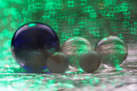 Glass made of crystal-like materials photographed in the studio with colorful backgroundの写真素材