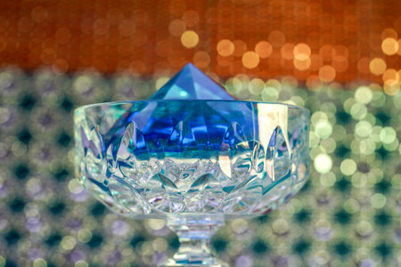 Glass made of crystal-like materials photographed in the studio with colorful backgroundの写真素材
