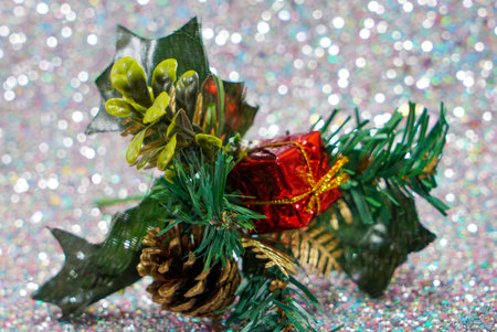 Christmas with red candles and christmas tree balls and green fir branches and pine cones