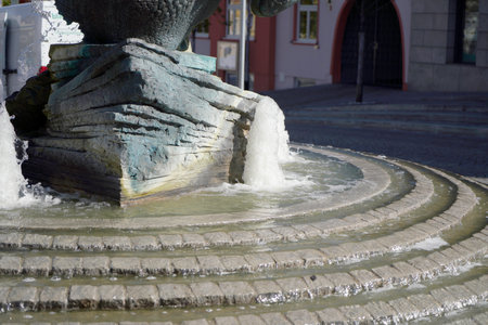 Water drops on a paintbrushes and a crystal ball on a white backgroundの写真素材