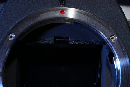 Close-up of a camera lens with a shallow depth of field