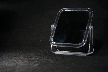Close-up image of a glass box isolated on black background.