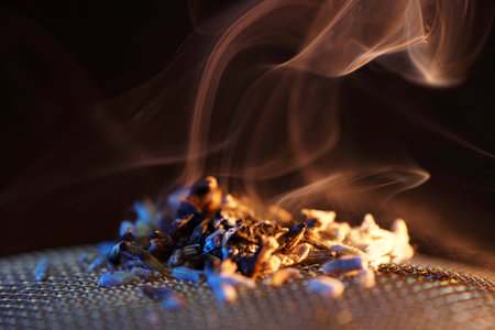 Aromatic tea on a dark background with smoke, close upの写真素材