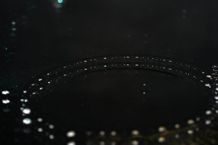 Water drops on a black background. Shallow depth of field.