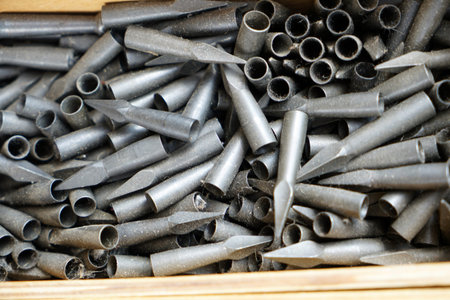 Pile of metal pipes in a box, closeup of photo