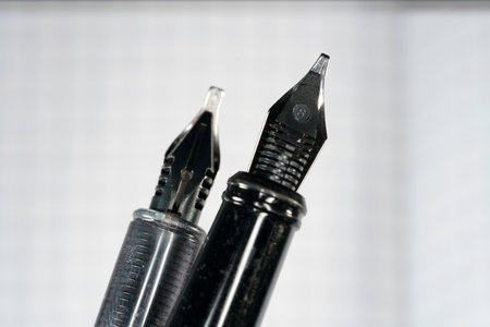 Close-up of a black fountain pen on a white background.の写真素材