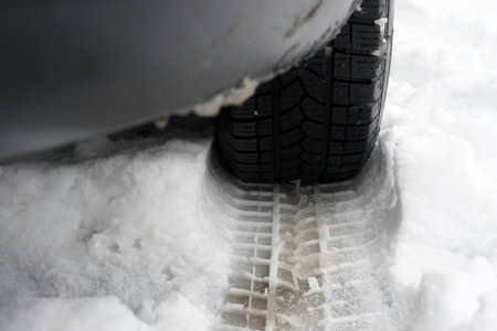 Car tires in the snow. Winter tires in the snow. Winter tires
