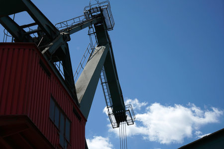 Cargo crane against the blue sky. Industrial background. cargo port.