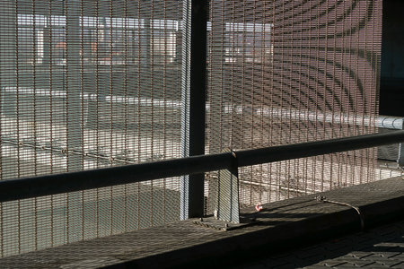 metal mesh fence on the street, photo as a background, digital imageの写真素材