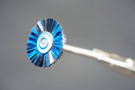 dental mirror and toothbrush on gray background, close-upの写真素材