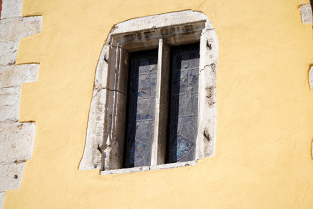 Window in the wall of an old house. Background and texture.の写真素材