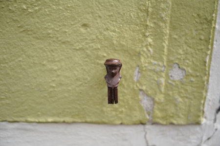 Old rusty key on the wall of the house. Selective focus.の写真素材