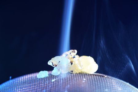 sparks from the incense burner on a dark blue backgroundの写真素材