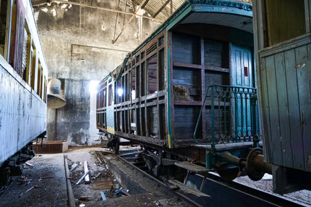 Old train wagon in an abandoned railway station at night. Abandoned train station.