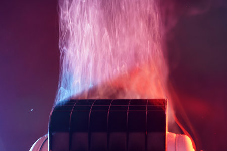Close-up of a heating radiator in the dark with a lot of smokeの写真素材