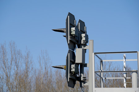 Railway crossing lights on blue sky background, closeup of photoの写真素材