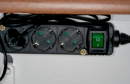 Closeup of a power strip on a white background with copy space