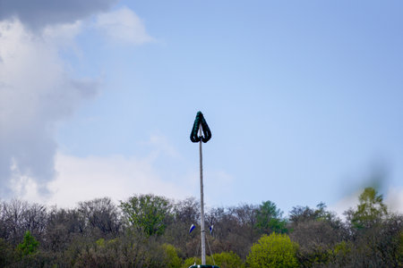 Climbing pole in the park with blue sky and white cloudsの写真素材