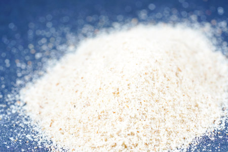 White flour on a blue background. Shallow depth of field.の写真素材
