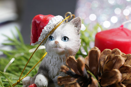 Christmas with red candles and Christmas tree balls and green fir branches and pine conesの写真素材