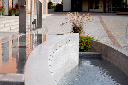 Outdoor swimming pool in the city. Water in the fountain.の写真素材