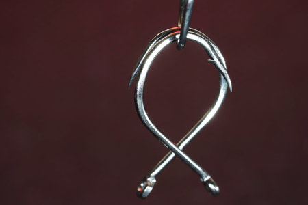 Fishing hook on a dark background. Close up. Selective focus.の写真素材