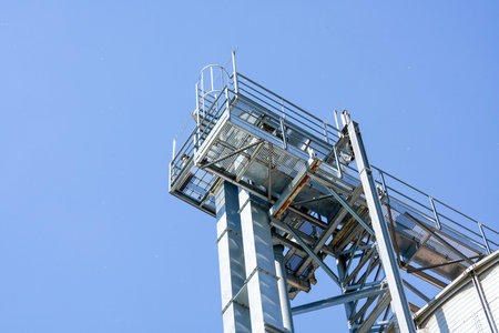 Industrial metal structure against blue sky, close-up of photo