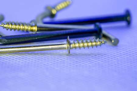 A colorful mix of nails and screws with eyelets and hoesの写真素材