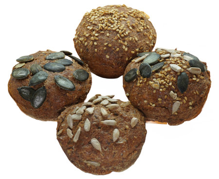 Freshly baked bread with sunflower seeds on a white background.の写真素材