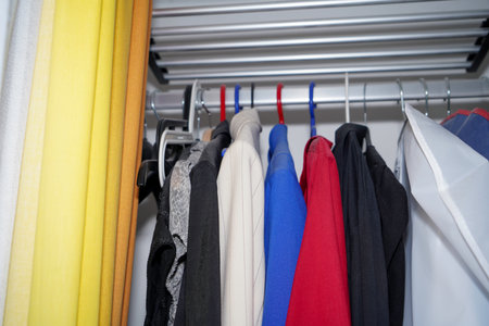 laundry in the closet and tidying up with colorful fabricsの写真素材
