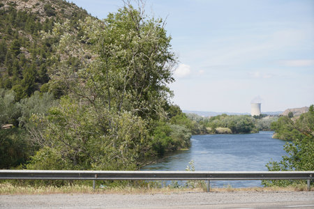 Nuclear power plant on the Rio Ebro in Spain with a cooling tower in a beautiful landscapeの写真素材