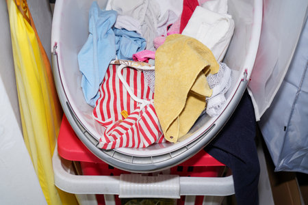 laundry in the closet and tidying up with colorful fabricsの写真素材