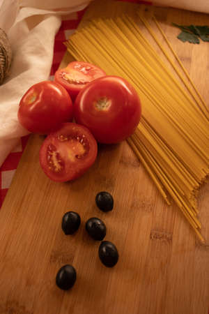 Tomatoes for cooking pasta with olives. Fresh, healthy food.の写真素材