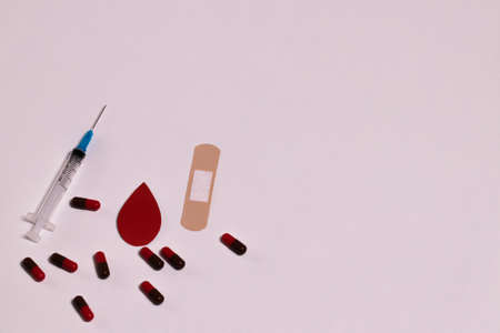 World Hemophilia Day. A drop of blood on a white background. World Blood Donor Day. World Diabetes Day.の写真素材