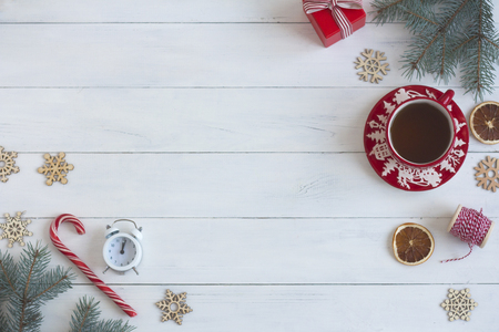 Christmas objects on a white wooden table top view. Christmas backgroundの写真素材