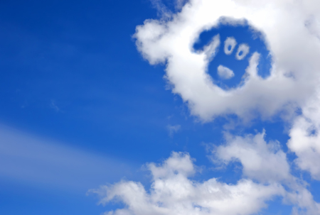 dogs face in the sky cloudsの写真素材
