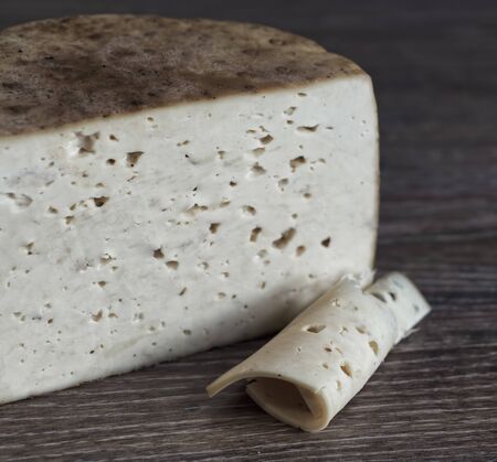 Craft cheese from cows and goats milk. Cheese headの写真素材