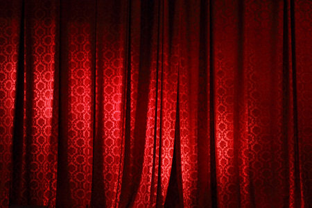 <p>Closed red curtain in the theater before the performance</p>の写真素材