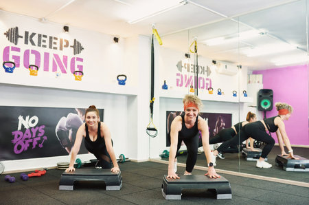 women on training in the gym. sports activities, exercise under the guidance of a trainer