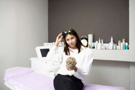 portrait of a young woman in a salon of laser epilation.の写真素材