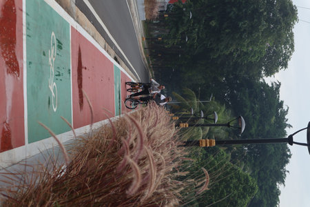 Jakarta, 26 November 2022. Street view in Taman Mini Indonesia Indah. Some people go for a walk in...