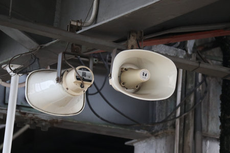 Megaphone on the roof of an industrial building, closeup of photoの写真素材