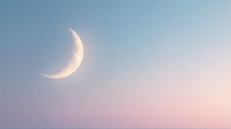 Peaceful crescent moon glows softly in the pastel sky evoking dreams of new beginnings and gentle nightsの素材