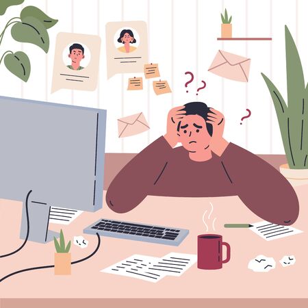 Man working remotely during quarantine at home.Freelancer is stressed through a lot of work.Young man sitting at the desk in his room and working.の写真素材