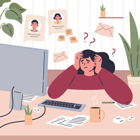 Girl working remotely during quarantine at home.Freelancer is stressed through a lot of work.Young woman sitting at the desk in her room and workingの写真素材