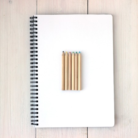 Color pencils on sketchbook, concept of drawing, top viewの写真素材