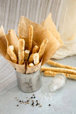 Snack bread sticks with salt and spicesの写真素材