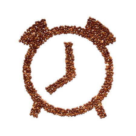 Porridge buckwheat in the form of clock. healthy eating time, food conceptの写真素材