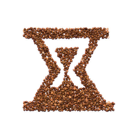 Porridge buckwheat in the form of hourglass. healthy eating time, food conceptの写真素材