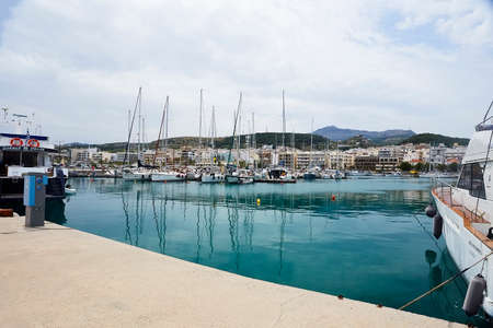 RETHYMNO, THE CRETE ISLAND, GREECE - MAY 30, 2019: Beautiful big white yachts in the seaport of the Rethymno, the Crete island, Greeceのeditorial素材
